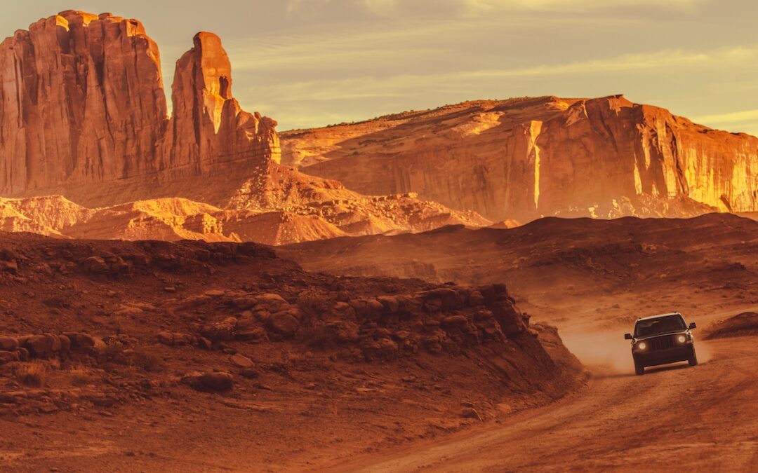 Off Road Drive in Arizona Countryside. Red Sandstones Desert Road with Sport Utility Vehicles.