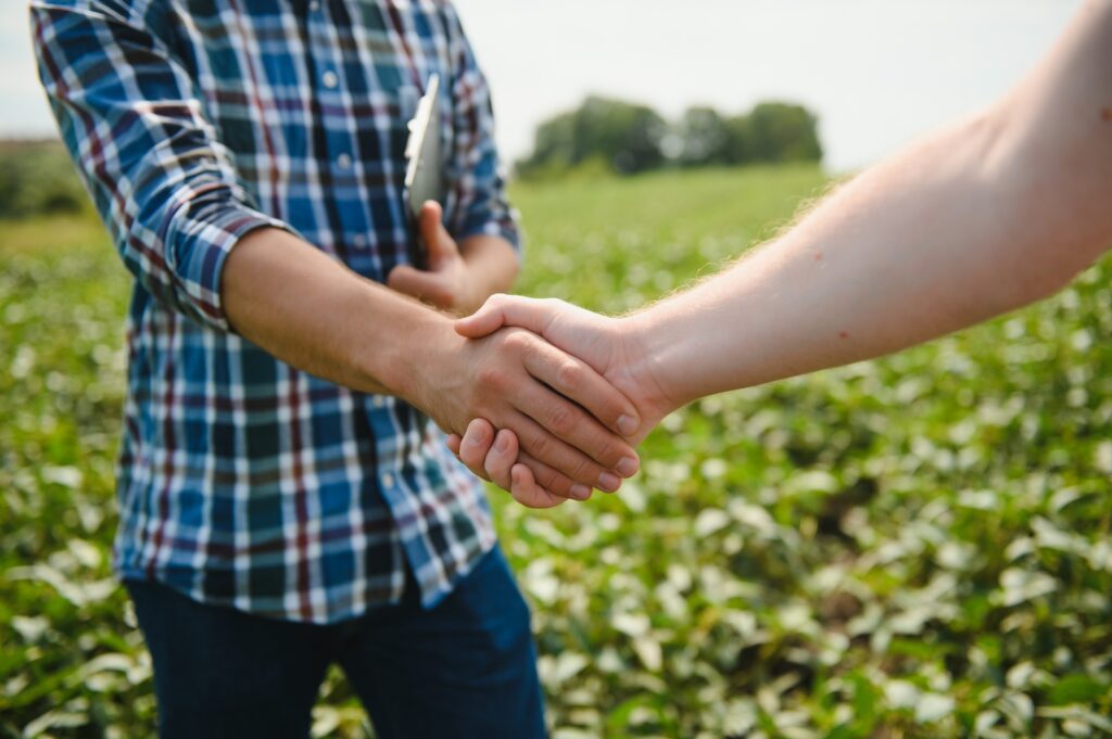 Two men shaking hands as they agree on Ag Financing for Mortgage Brokers 